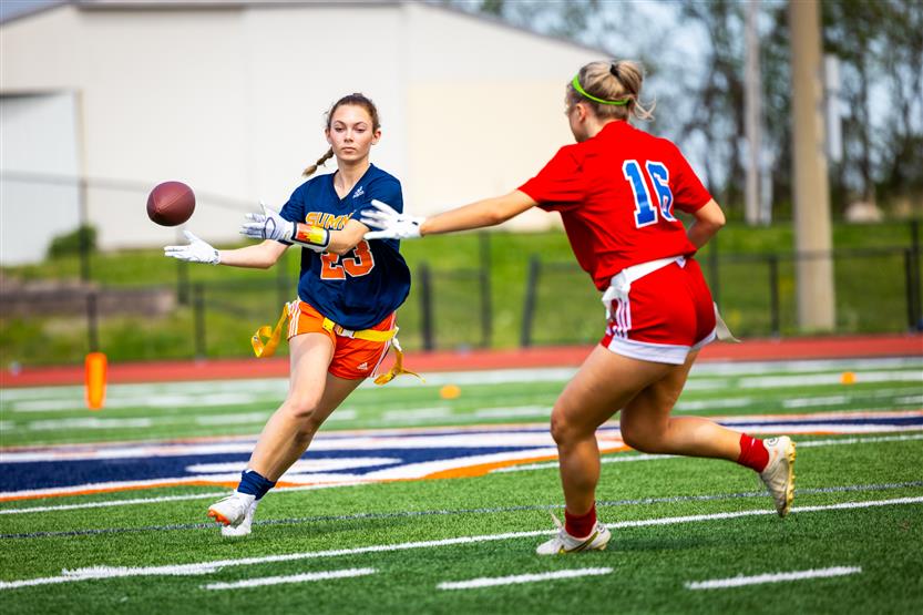 Students play flag football